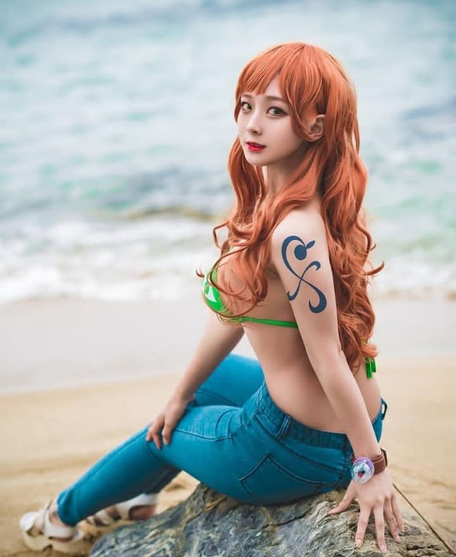 One Piece: Bỏng mắt với bộ ảnh cosplay miêu tặc Nami mặt xinh, dáng chuẩn khiến fans đứng ngồi không yên - Ảnh 9.