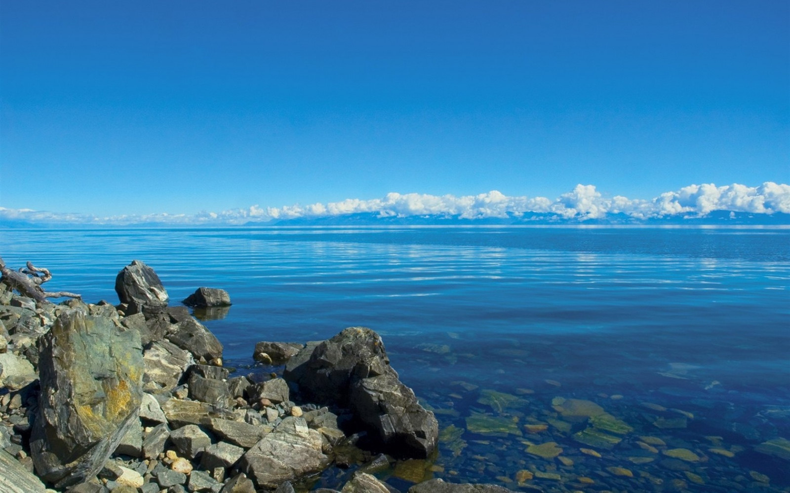 sea, bay, lake, water, rock, shore, sky, stones, clouds, calm, Tourism, coast, horizon, Siberia, cape, baikal, mountain, ocean, transparent, promontory, coastal and oceanic landforms